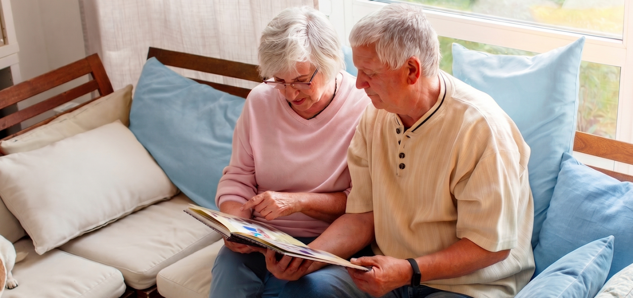 two people looking at album