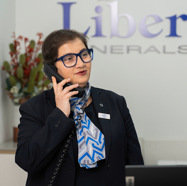 Liberty funeral director on the phone