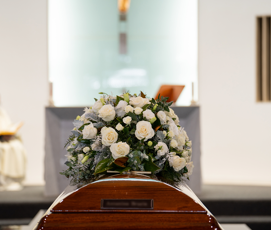 flowers on top of a coffin